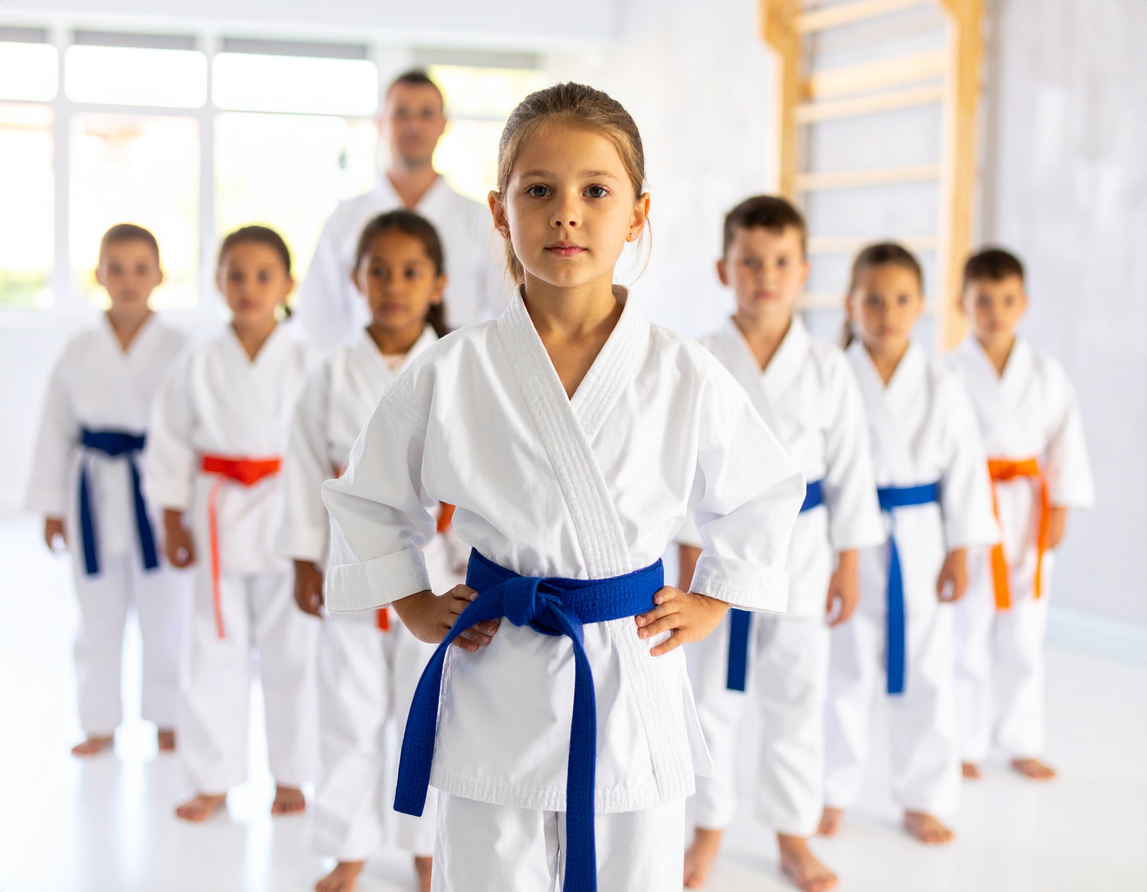 Focused kids wearing blue and orange belts during Judo class at Darfight Martial Arts in Brooklyn